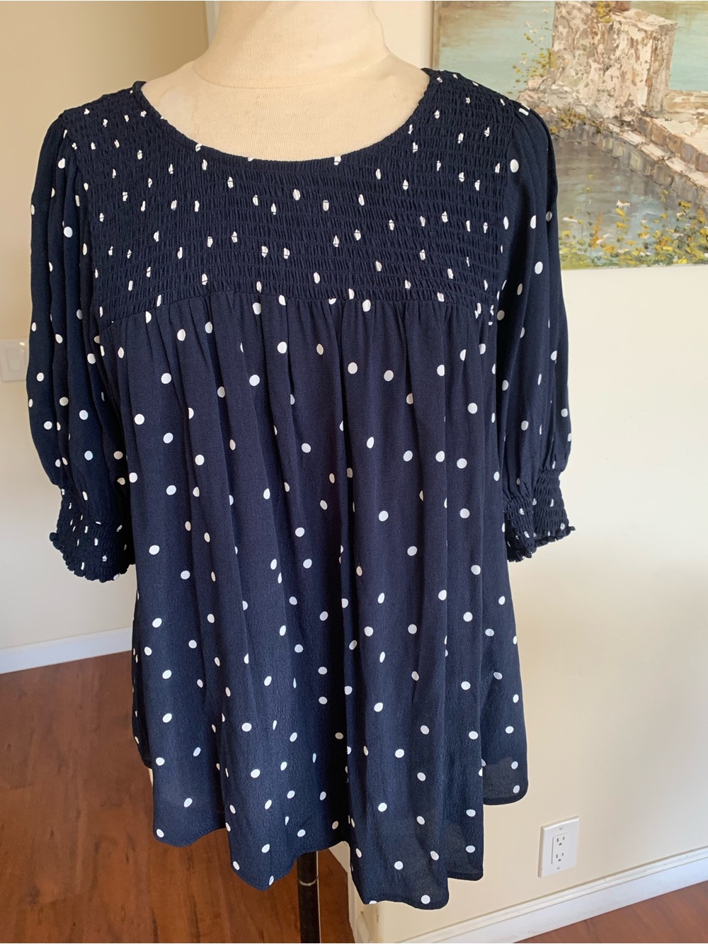 Terra & Sky Navy Polka Dot Smocked Peasant Blouse, with elastic smocking yoke
I